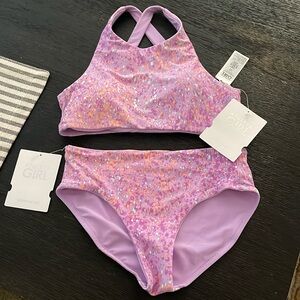Girls Athleta 2 piece bathing suit. Reversible. Size 12 brand new with tags